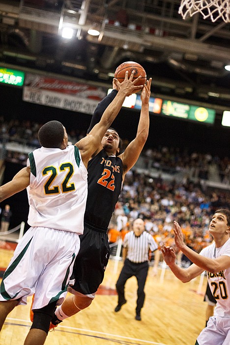 &lt;p&gt;Marcus Colbert puts up a jump shot over Borah guard Isaiah Wright.&lt;/p&gt;