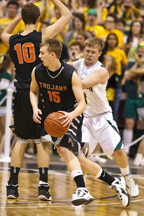 &lt;p&gt;Post Falls' Luke Thoreson drives around a pick in the first half against Borah.&lt;/p&gt;