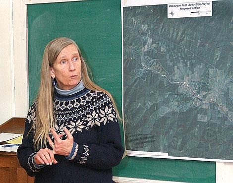 Photo by Nick Ianniello Superior District Ranger Sharon Sweeney talks to West End residents Thursday about the DeBaugan Fuels Reduction Project Draft Environmental Impact Statement that the Forest Service recently produced.