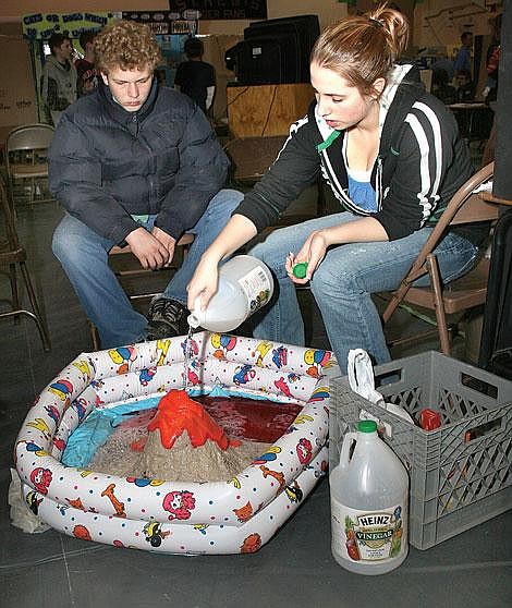 Photo by Nick Ianniello St. Regis freshman Jocelyn Dockter shows off her baking soda and vinegar volcano at Wednesday&#146;s science fair. Each student in the fair presented their project to a judge as part of their individual scoring.