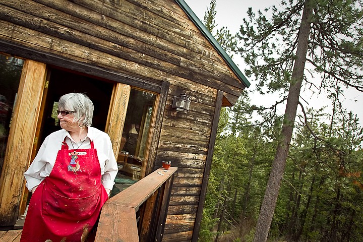 &lt;p&gt;Jaquith Travis stands outside the entrance of her hilltop home above Hauser Lake where she spends her days painting on either a canvas or her two computer monitors in her studio.&lt;/p&gt;