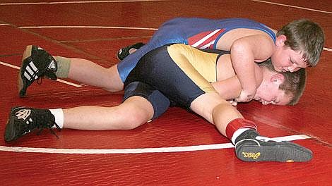 Superior's Tucker McClees takes Thompson Falls&#146; Riley Riffle to the mat in the beginner 50-pound class Thursday. Mission/Charlo/Dixon, Thompson Falls and Plains-Hot Springs each sent teams to the duals at Superior. McClees won.