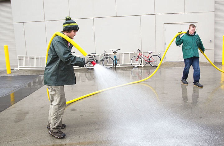 &lt;p&gt;TJ Bomar, left, and Mike Parmenter, landscapers at the Coeur d'Alene Resort work together to do the &quot;weekly wash-down,&quot; said Bomar, on Wednesday morning.&lt;/p&gt;