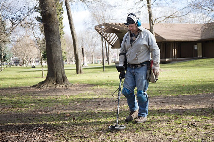 &lt;p&gt;Coeur d'Alene resident Mark Arbic takes advantage of a sunny day and searches with his metal detector for hidden or lost objects on Saturday at City Park in Coeur d'Alene. &quot;I've just found pocket change so far&#133;when you find a gold coin it's like the Holy Grail!&quot; Says Arbic.&lt;/p&gt;