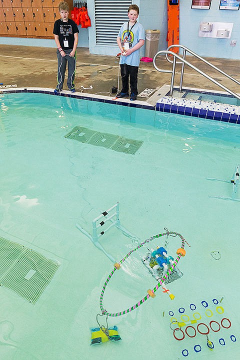 &lt;p&gt;Robbie Jensen, a sixth-grade student at Lakes Magnet School, right, drives his team&#146;s underwater robot, Tardis, as seventh-grade classmate Taylor Pressdee helps keep the attached cable from tangling during a test run of their Sea Perch with a group from Gizmo Tuesday at the Kroc Center in Coeur d&#146;Alene. Students will be competing in a regional competition, sponsored by the U.S. Navy, that will include about 30 teams from Idaho and Washington on February 21. The competition will judge performance through a timed obstacle course that includes controls like steering and lifting and placing items.&lt;/p&gt;