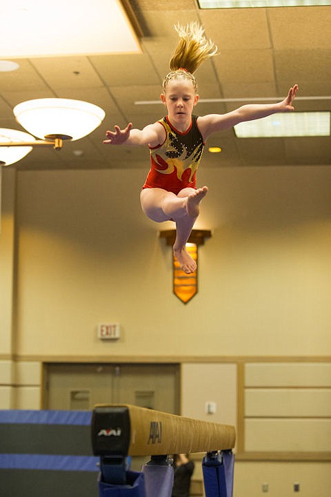 &lt;p&gt;Emma Lees, 13, of Calgary Canada leaps high on the balance beam during the 14th Great West Gymfest on Saturday at the Coeur d'Alene Resort Convention Center. Lees is just one of thousands of athletes competing this weekend.&lt;/p&gt;