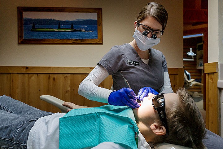 &lt;p&gt;Brenna Cowan, dental hygienist at Avondale Dental Center in Hayden Lake, inspects the teeth of Connor Hay, 9, during their annual event Give Kids a Smile Day on Friday. The office has been participating in the American Dental Association sponsored event for about 15 years, offering nearly $30,000 worth of free dental services just this year.&lt;/p&gt;