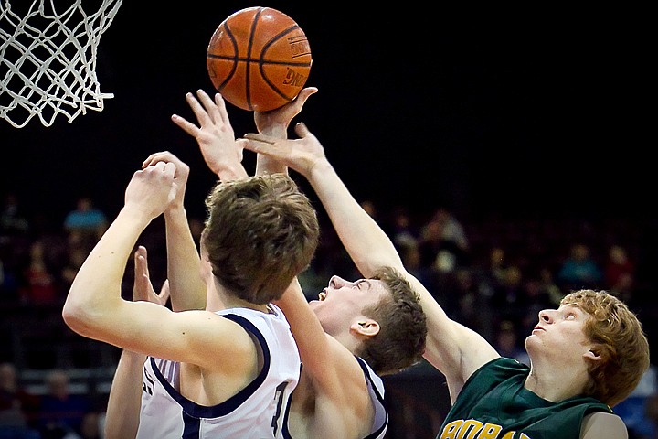 &lt;p&gt;Lake City's Mark Smyly is caught between his teammates and Travis Lloid from Borah High who were all battling for the rebound.&lt;/p&gt;