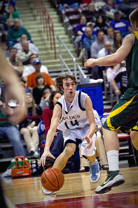 &lt;p&gt;Lake City's T.J. Philp looks to make a pass into the key during the first half of the T-Wolves 52-46 loss to the Lions at the state 5A boys basketball tournament Thursday at the Idaho Center in Nampa.&lt;/p&gt;