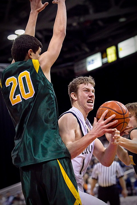 &lt;p&gt;Lake City's Mark Smyly tries to power through the defense of Ben Tucakovic from Borah High during the first half of the T-Wolves 52-46 loss to the Lions at the state 5A boys basketball tournament Thursday at the Idaho Center in Nampa.&lt;/p&gt;