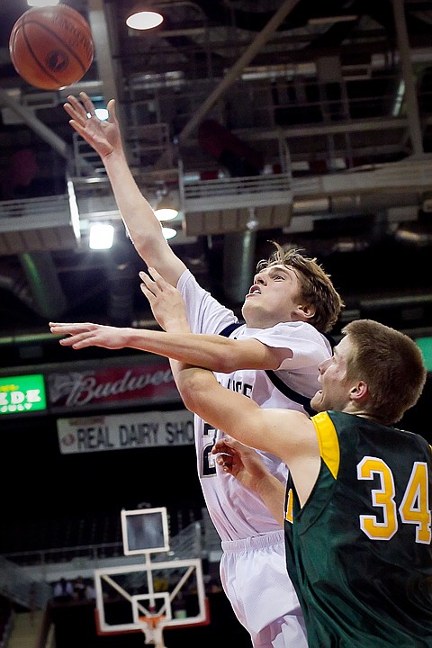 &lt;p&gt;Lake City's J.J. Stoddard goes up for a shot in front of Craig Spjute from Borah High during the first half of the T-Wolves 52-46 loss to the Lions at the state 5A boys basketball tournament Thursday at the Idaho Center in Nampa.&lt;/p&gt;