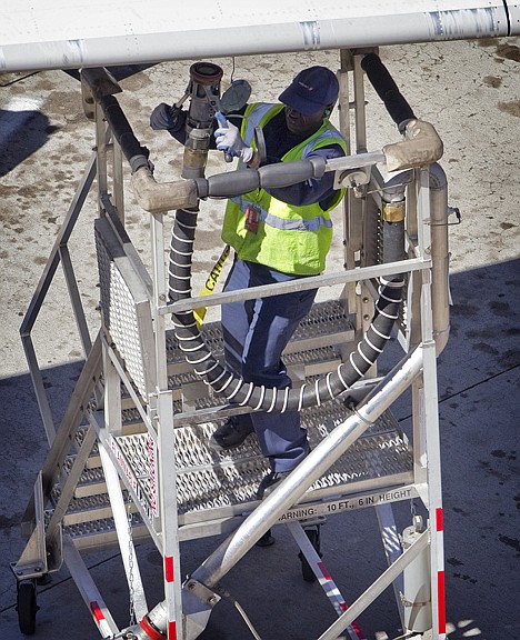 &lt;p&gt;An airliner is refueled Wednesday at Sky Harbor International Airport in Phoenix. Oil prices settled above $104 per barrel for the first time since September of 2008 as fighting escalated in Libya and petroleum demand grew in the U.S.&lt;/p&gt;