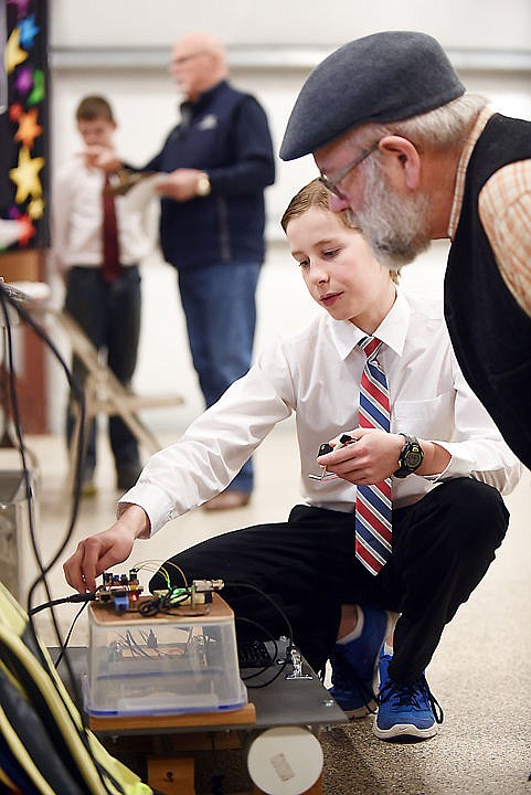 &lt;p&gt;&lt;strong&gt;Luke Ritzdorf&lt;/strong&gt;, a seventh grader at Kalispell Middle School, explains his project to volunteer judge Paul Watson of Columbia Falls. Ritzdorf&#146;s project was titled, &#147;Building an Autonomous Water-quality Measurement System.&#148;&lt;/p&gt;&lt;div&gt;&#160;&lt;/div&gt;