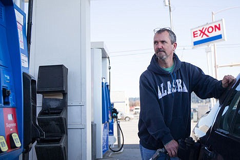 &lt;p&gt;Kent Peach of Medical Lake fills his car up with gas costing $2.15 a gallon on Wednesday in Coeur d'Alene. Although the price of gas is rising, he still buys his gas in Idaho whenever he can.&lt;/p&gt;