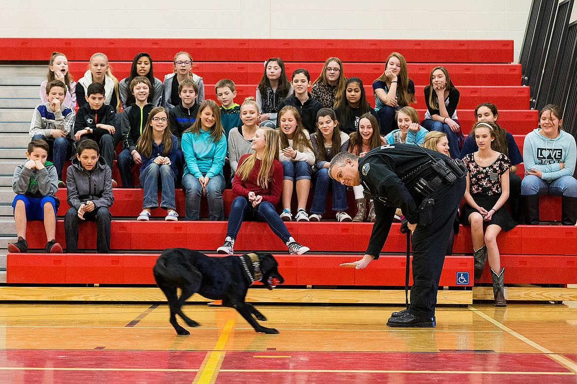 &lt;p&gt;Spirit Lake Police Chief Keith Hutcheson demonstrates commands and behavior of the department&#146;s explosive detection dog, Shade, during a visit to Canfield Middle School Friday in Coeur d&#146;Alene.&lt;/p&gt;