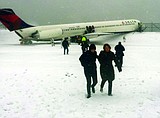 Plane skids off LaGuardia runway
