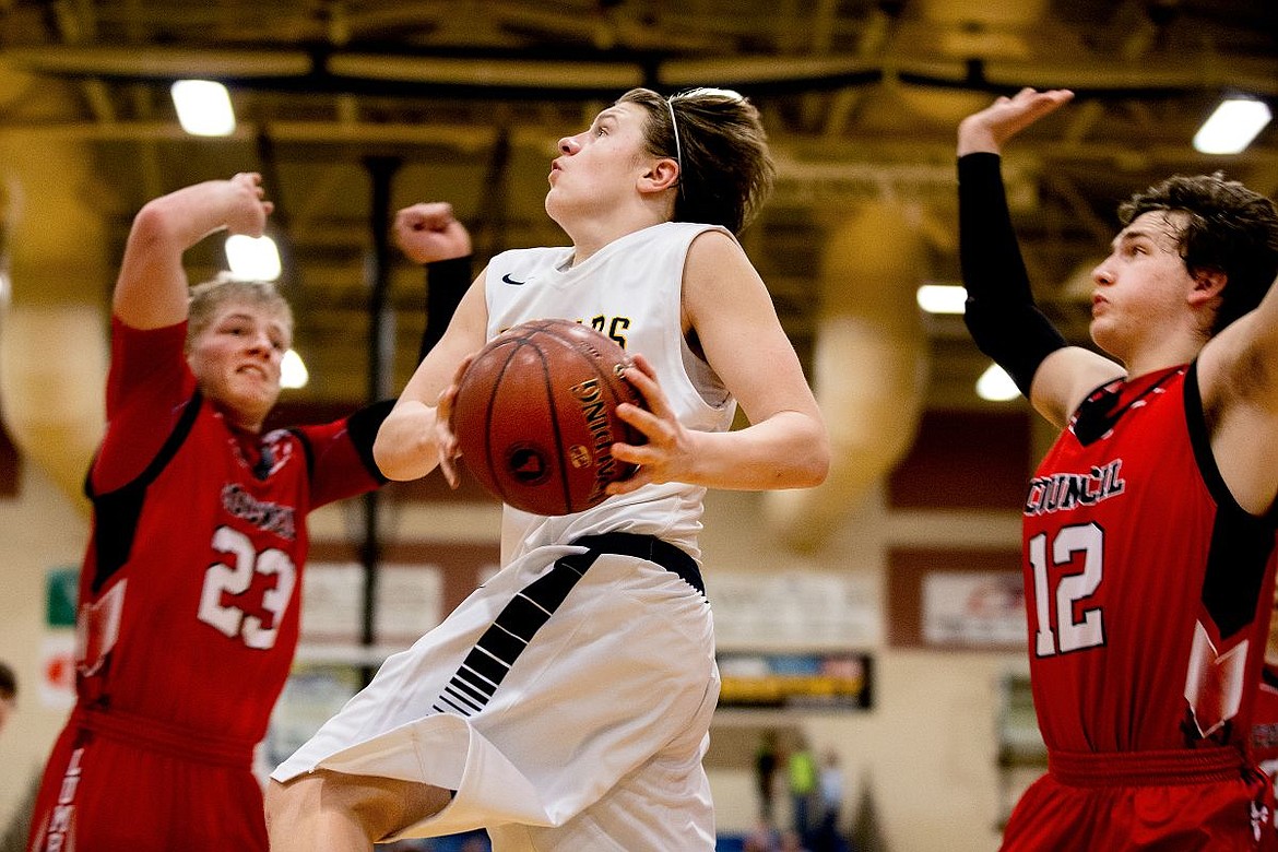 &lt;p&gt;JAKE PARRISH/Press Genesis Prep guard Jonny Hillman soars towards the basket past Council wing Jared Neal, right, and Council wing JT Mahon at the 1A Division II semifinal game on Friday, March 4, 2016 at Caldwell High School in Caldwell, Idaho.&lt;/p&gt;