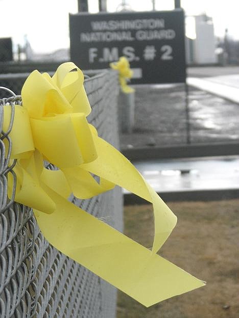 Yellow ribbons showing support for the 1161st Transportation Company's approaching deployment to Iraq are attached to a fence at the unit's Ephrata office. Photo by Lynne Lynch/Columbia Basin Herald