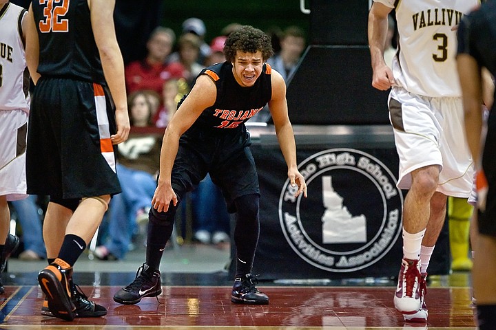 &lt;p&gt;Post Falls High's Malcolm Colbert grimaces as he gets off the floor holding his knee following a collision with a Vallivue High player in the first half of the Trojan's tournament opener against Vallivue High at the state 5A championships Thursday.&lt;/p&gt;