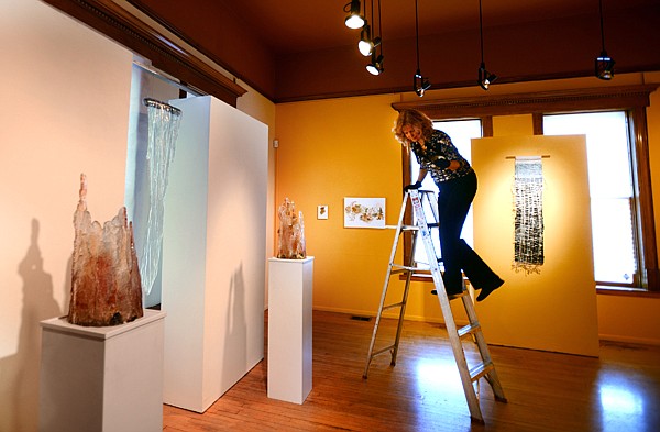 &lt;p&gt;Executive Director/Curator Liz Moss arranges the lighting for the new show &quot;Of the Earth&quot; on Tuesday morning, February 26, at the Hockaday Museum of Art in Kalispell. The opening reception for Of the Earth is tonight from 5 to 7p.m. and is free and open to the public. (Brenda Ahearn/Daily Inter Lake)&lt;/p&gt;