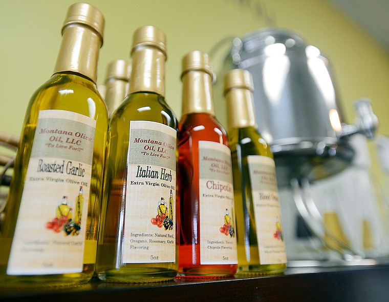 &lt;p&gt;Montana Olive Oil Company bottles on display at the Apple Barrel's new location on Center Street in Kalispell on Thursday, February 28, in Kalispell. (Brenda Ahearn/Daily Inter Lake)&lt;/p&gt;