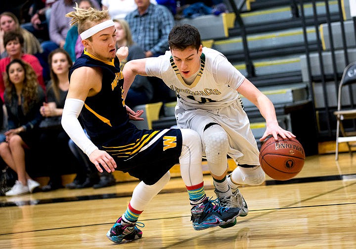 &lt;p&gt;St. Maries guard Jake Sieler is tripped up by Wendell guard Josh Rocha at the 2A state third place game on Saturday at Capital High School in Boise, Idaho. St. Maries fell to Wendell, 71-62. PURCHASE PHOTO: www.cdapress.com/photos&lt;/p&gt;