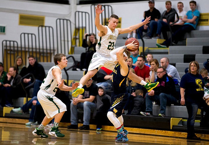 &lt;p&gt;St. Maries post Bryant Asbury (23) gets airborne as he and teammate St. Maries guard Dakota Wilson attempt to block Wendell guard Josh Rocha's pass at the 2A state third place game on Saturday at Capital High School in Boise, Idaho. St. Maries fell to Wendell, 71-62. PURCHASE PHOTO: www.cdapress.com/photos&lt;/p&gt;