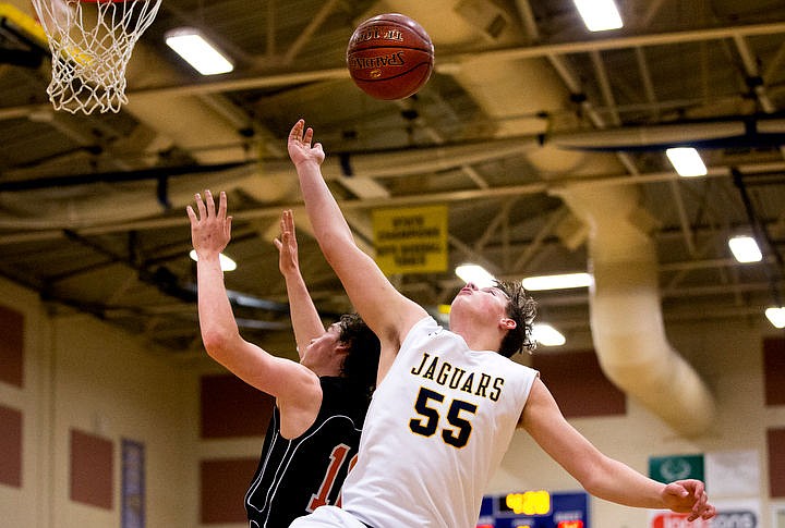 &lt;p&gt;Genesis Prep forward Caleb Symons battles for a rebound with Clark County guard Landon May at the 1A Division II state third place game on Saturday at Caldwell High School in Caldwell, Idaho. The Jaguars defeated the Bobcats 57-30. PURCHASE PHOTO: www.cdapress.com/photos&lt;/p&gt;