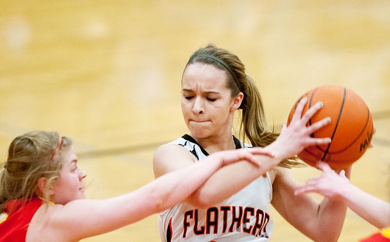 &lt;p&gt;Flathead freshman Kelsey Noland-Gollespie (24) protects the ball Tuesday night during Flathead's victory over Hellgate at Flathead High School. March 4, 2014 in Kalispell, Montana. (Patrick Cote/Daily Inter Lake)&lt;/p&gt;