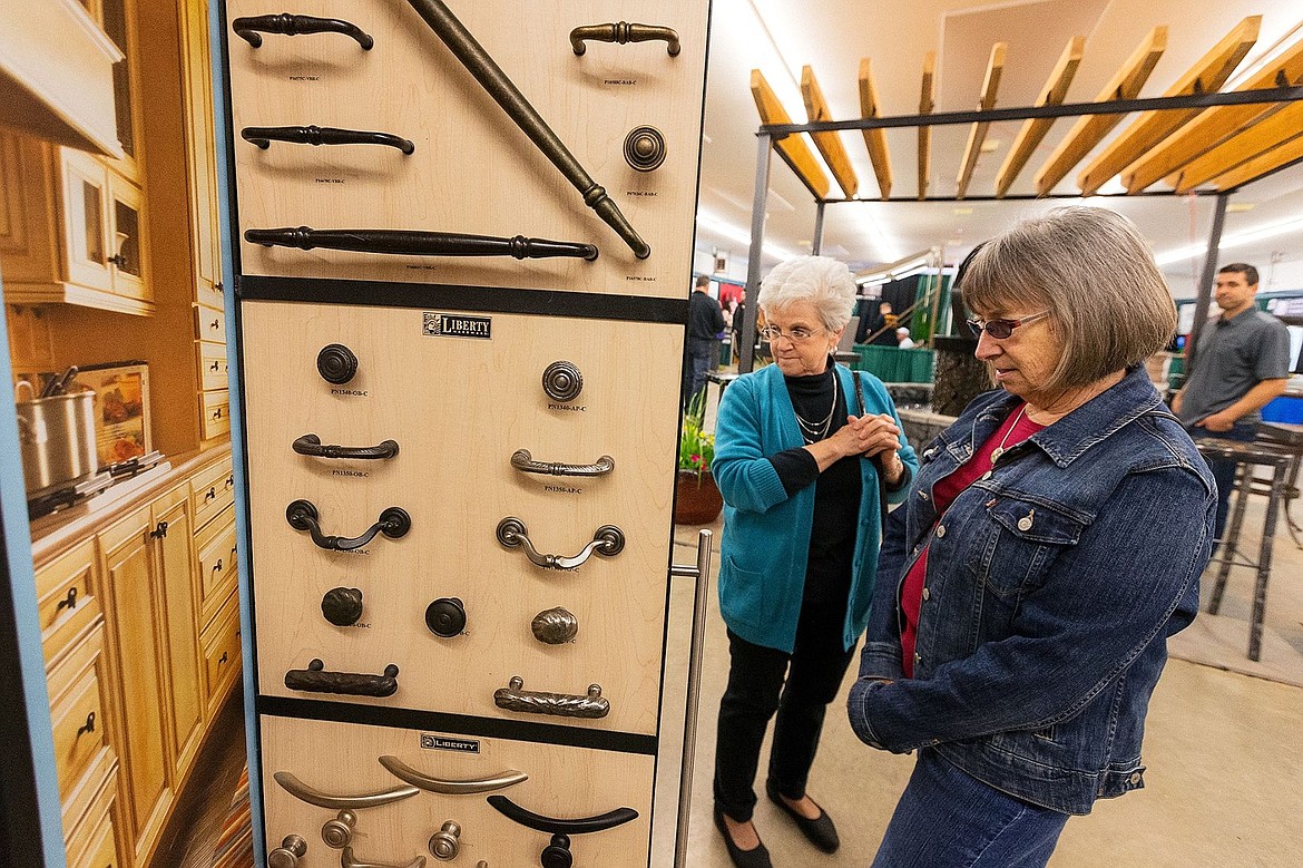 &lt;p&gt;Patsy Sweet, right, and Shirley Knoles check out a display of cabinet hardware at The Woodmill Kitchen Cabinets booth.&lt;/p&gt;