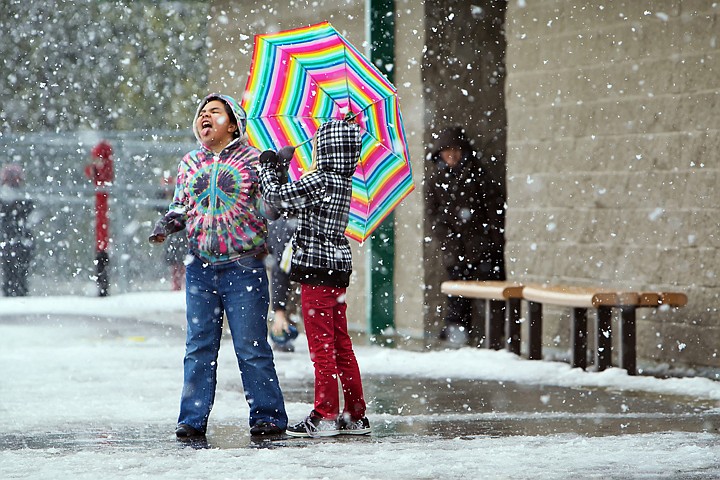 &lt;p&gt;JEROME A. POLLOS/Press Ashley Jennings, 9, comes out from under the shelter of her colorful umbrella to catch snowflakes on her tongue Tuesday while at recess with her friend Tyhler Fulkerson, 8, at Atlas Elementary in Hayden.&lt;/p&gt;