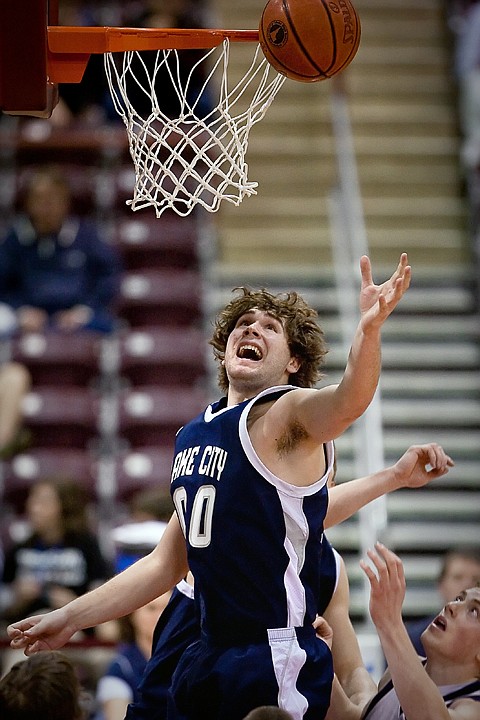 &lt;p&gt;Wes Beusan from Lake City High jumps above players from Rocky Mountain High as he goes up for a rebound.&lt;/p&gt;