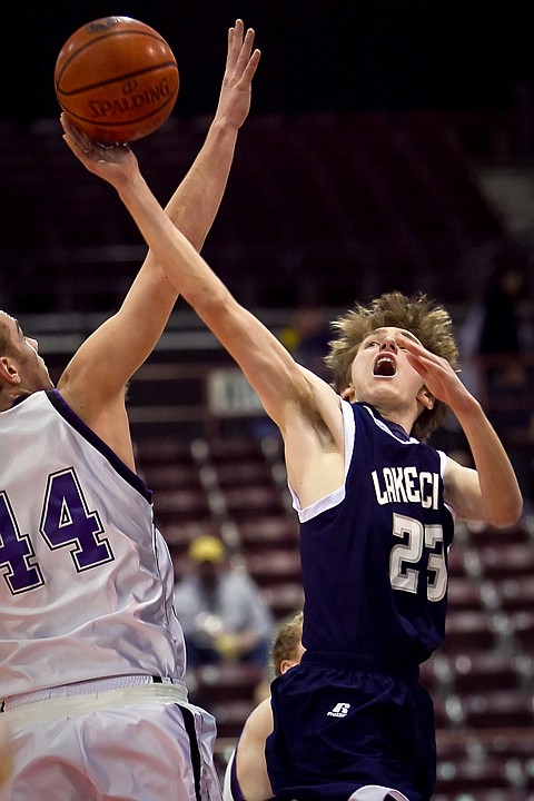 &lt;p&gt;J.J. Stoddard from Lake City High goes up for a shot against the defense of Rocky Mountain High's Ryan Strand during the first half of their game Friday at the state 5A boys basketball tournament at Idaho Center in Nampa. The T-Wolves were eliminated from the tournament after the 72-52 loss to the Grizzlies.&lt;/p&gt;
