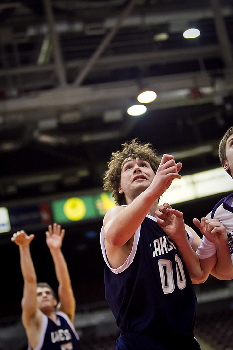 &lt;p&gt;Lake City High's Wes Beusan waits for his teammate Chris Wheelock's free throw while getting position in front of Rocky Mountain High players Friday at the state 5A boys basketball tournament at Idaho Center in Nampa.&lt;/p&gt;