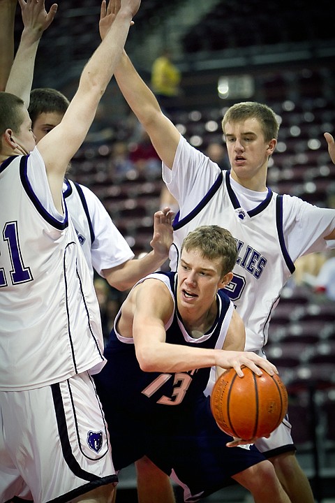 &lt;p&gt;Lake City High's Mark Smyly tries to find a way out of a trap set by Rocky Mountain High Friday at the state 5A boys basketball tournament at Idaho Center in Nampa.&lt;/p&gt;