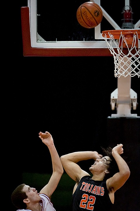 &lt;p&gt;Post Falls High's Marcus Colbert spots the ball for the rebound as Kyle Blanchard from Madison High does the same in the second half of their game Friday during the state 5A boys basketball tournament at the Idaho Center in Nampa.&lt;/p&gt;