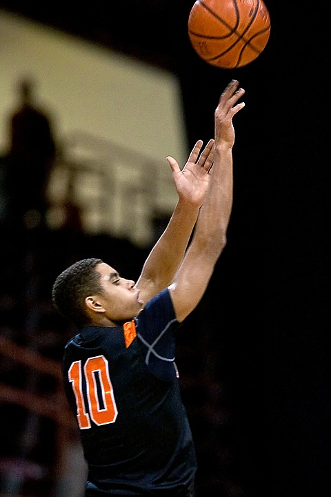 &lt;p&gt;Post Falls High's Shawn Reid puts up a three-point shot in the first half of Friday's game against Madison High during the state 5A boys basketball tournament at the Idaho Center in Nampa.&lt;/p&gt;