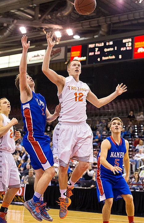 &lt;p&gt;The Trojans&#146; Ryan English is fouled by Nampa&#146;s Callan Gardner while going up for a shot in the first half.&lt;/p&gt;