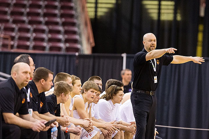 &lt;p&gt;Post Falls High School head boys basketball coach Mike McLean directs the players on the court during the first half in Nampa.&lt;/p&gt;