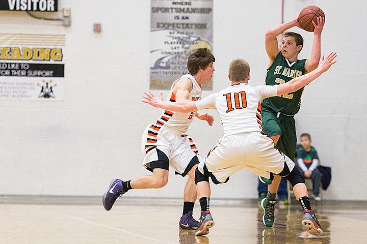 &lt;p&gt;St. Maries&#146; Dakota Wilson looks for a passing outlet over a pair of Declo defenders in the second half.&lt;/p&gt;