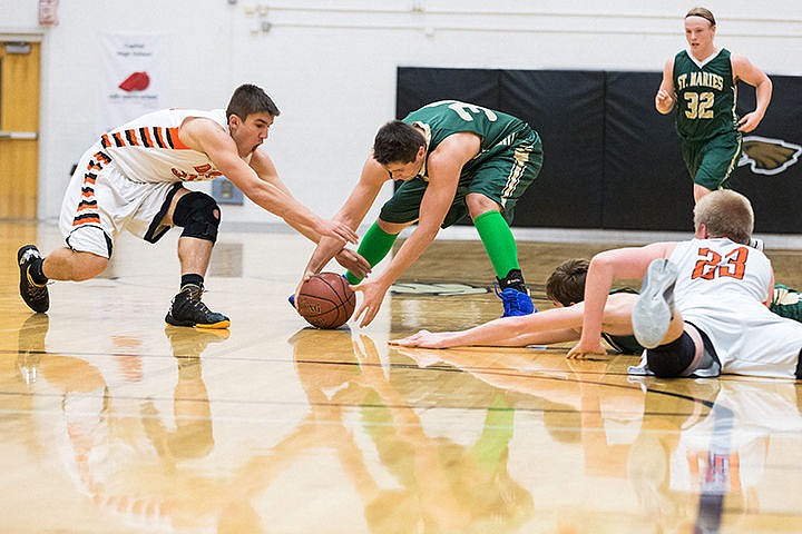 &lt;p&gt;St. Maries High&#146;s Logan Feasline scrambles with a Declo defender for a loose ball in the fourth quarter of the state 2A boys basketball tournament Thursday at Capital High School in Boise.&lt;/p&gt;