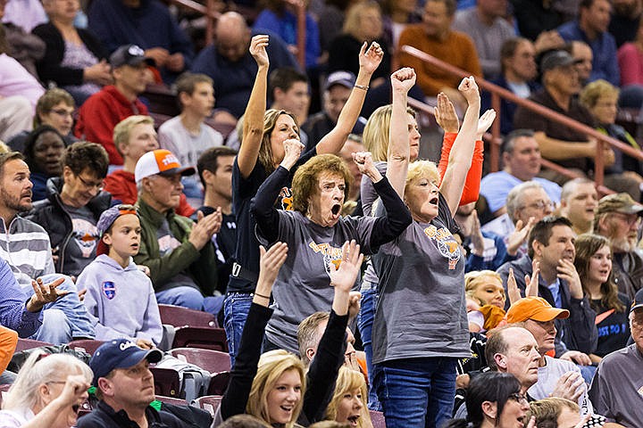 &lt;p&gt;Vonnie Satchwell and her daughter Cindy cheer for Post Falls after winning the first round of the state 5A boys basketball tournament against Nampa.&lt;/p&gt;