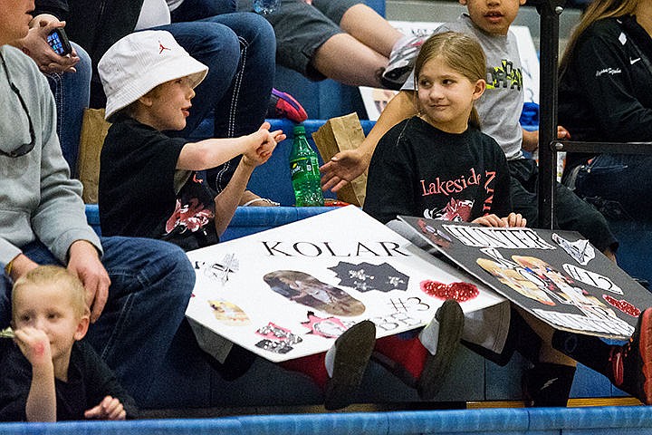 &lt;p&gt;Stockton Montague, 8, left, gestures to Meyha Wienclaw, 9, during the second half of the first round of the state high school playoffs.&lt;/p&gt;