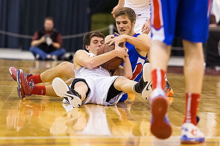 &lt;p&gt;Post Falls High School&#146;s Blake McLean battles with Nampa High School&#146;s Kooper Wilcox for a loose ball in the first period of the state 5A boys basketball tournament Thursday at the Idaho Center in Nampa.&lt;/p&gt;