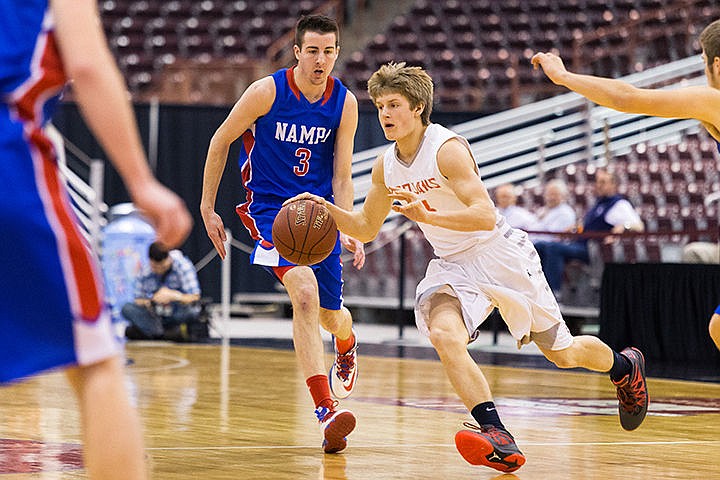 &lt;p&gt;Post Falls High&#146;s Wyatt Millsap dribbles between Nampa defenders in the first quarter at the Idaho Center.&lt;/p&gt;