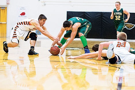 &lt;p&gt;St. Maries High&#146;s Logan Feasline scrambles with a Declo defender for a loose ball in the fourth quarter of the state 2A boys basketball tournament Thursday at Capital High School in Boise.To order prints go to http://cdapress.com/photojournalism.&lt;/p&gt;