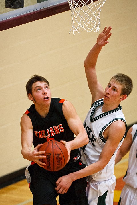 SHAWN GUST/Press

Post Falls' Connor Hill puts up a shot from the baseline Saturday against Eagle High School.