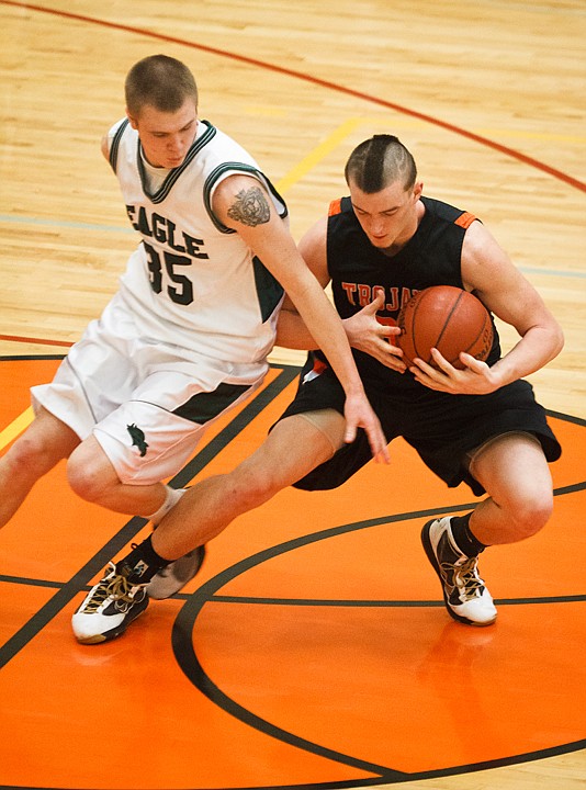 SHAWN GUST/Press

Matt Lickfold, of Post Falls, takes possession of a loose ball from Eagle's Daved Gillmor Saturday at Columbia High School in Nampa.