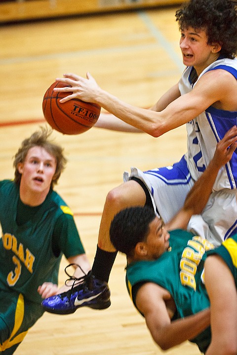 SHAWN GUST/Press

Viking guard Andrew Baracco drives through the Borah High School defense to score in the first half.