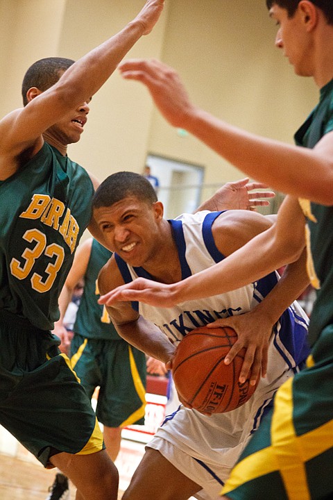 SHAWN GUST/Press

Deon Watson powers through two Borah defenders Saturday in the first half.